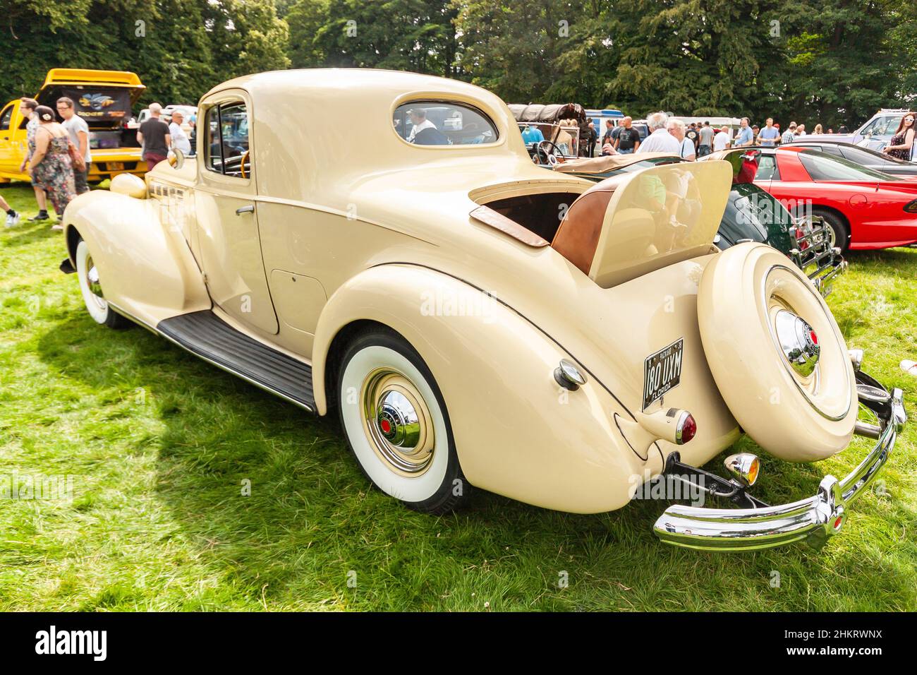 vintage 1938 cream Packard super eight coupe with rumble or dickey seat at American classic car show Stock Photo