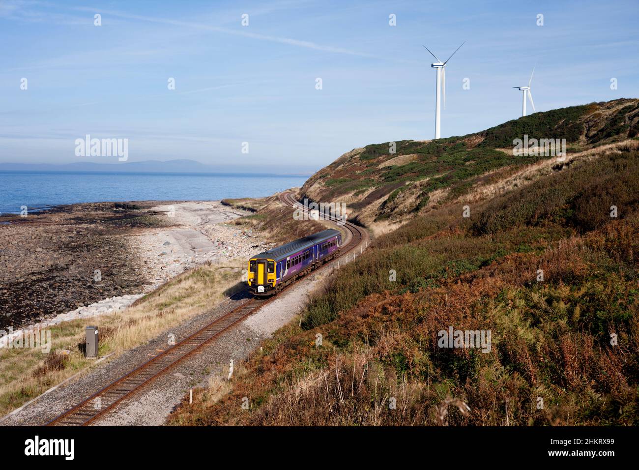 Northern Rail class 156 sprinter train 156481 by the sea at Lowca on the scenic Cumbrian coast railway line Stock Photo