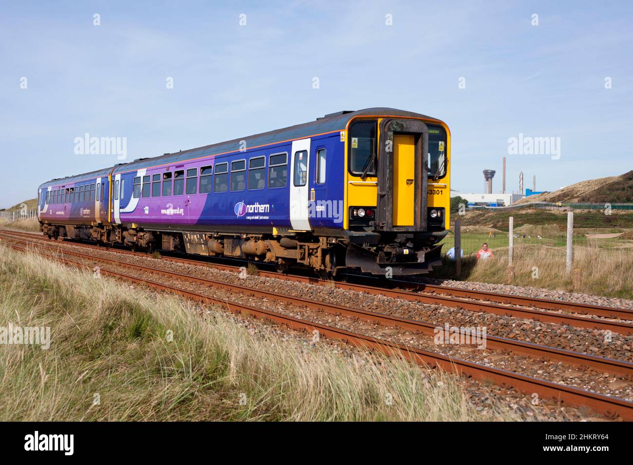 2 Northern rail class 153 sprinter trains 153301 + 153351 passing Sellafield on the Cumbrian coast railway line Stock Photo