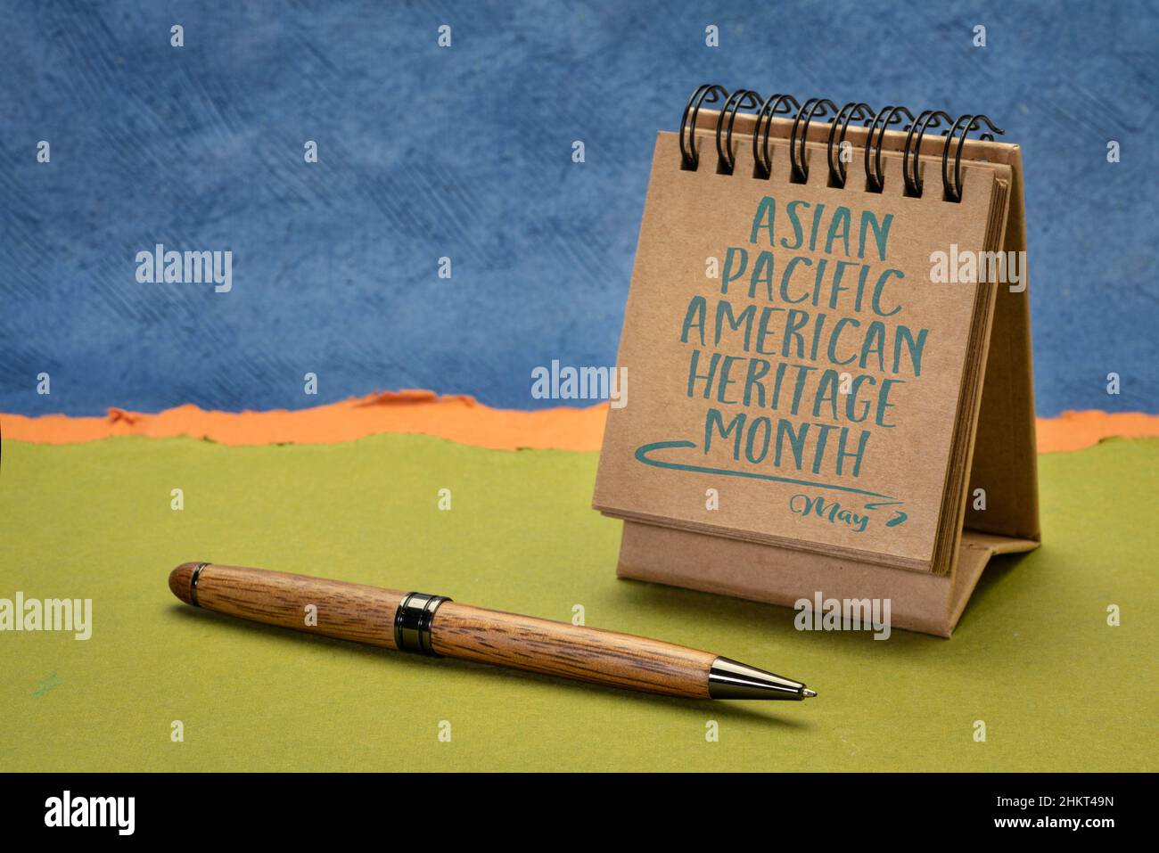 Asian Pacific American Heritage Month, May - handwriting in desktop calendar against abstract paper landscape, reminder of cultural event Stock Photo