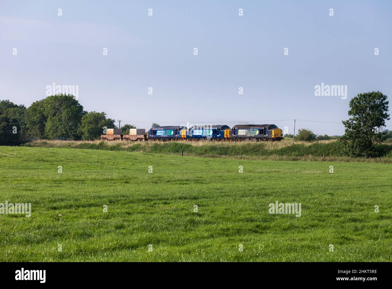3 Direct Rail Services class 37 locomotives, 37611  37261 37405  at the head of a Nuclear flask train from Sellafield  in the Cumbrian countryside Stock Photo