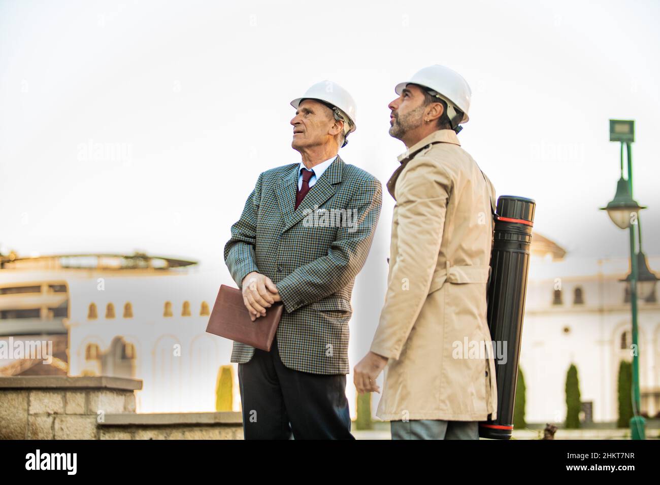 Two senior businessmen are looking and talking, close up Stock Photo ...
