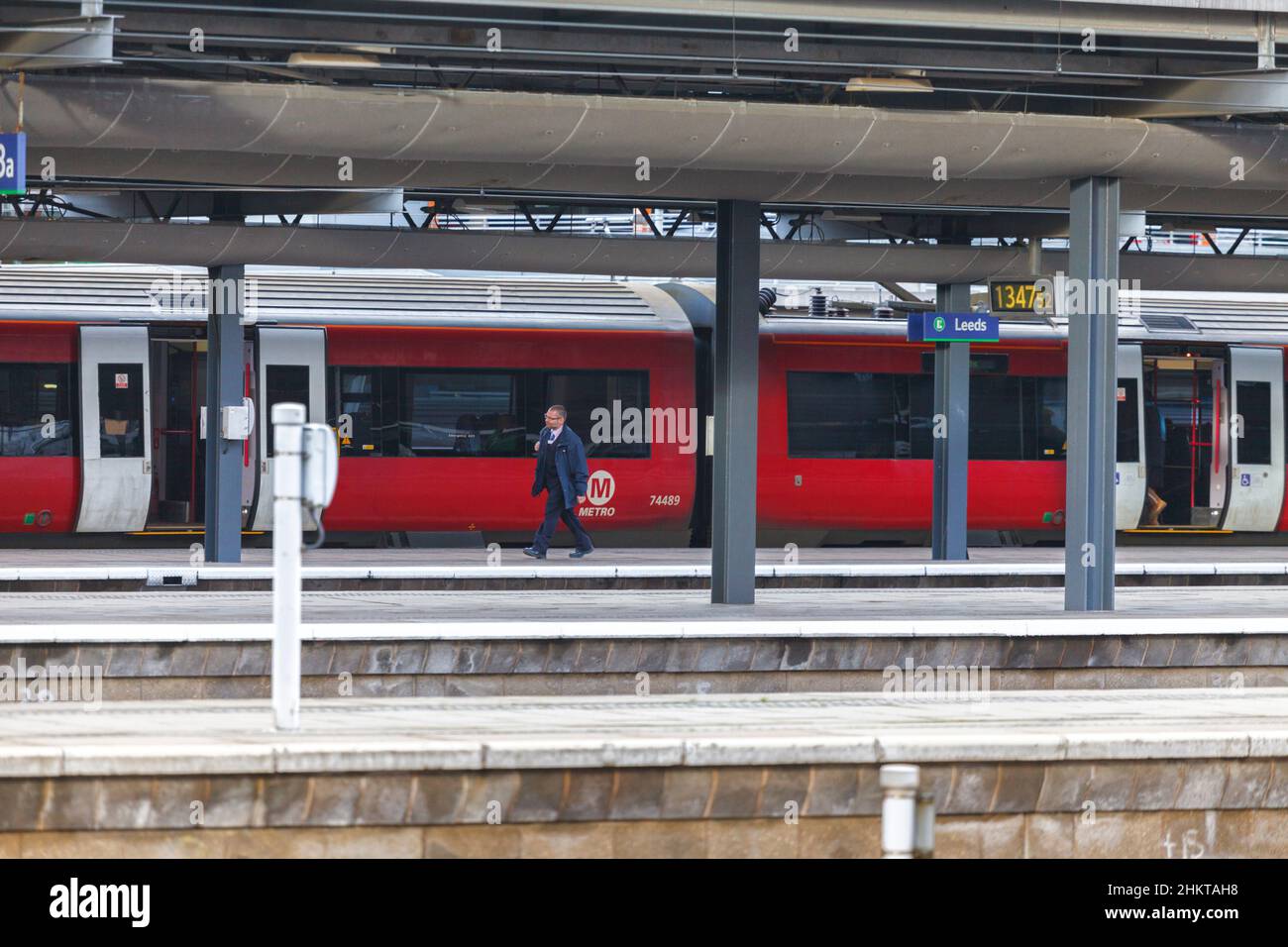 Northern rail train driver walking to the cab of a class 333 train at