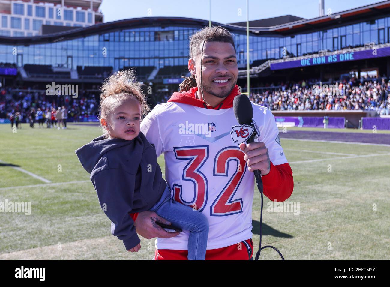 Las Vegas, Nevada, USA. 5th Feb, 2022. Kansas City Chiefs safety Tyrann Mathieu (32) getting interviewed with daughter in hand during the AFC Pro Bowl Practice at Las Vegas Ballpark in Las Vegas, Nevada. Darren Lee/CSM/Alamy Live News Stock Photo
