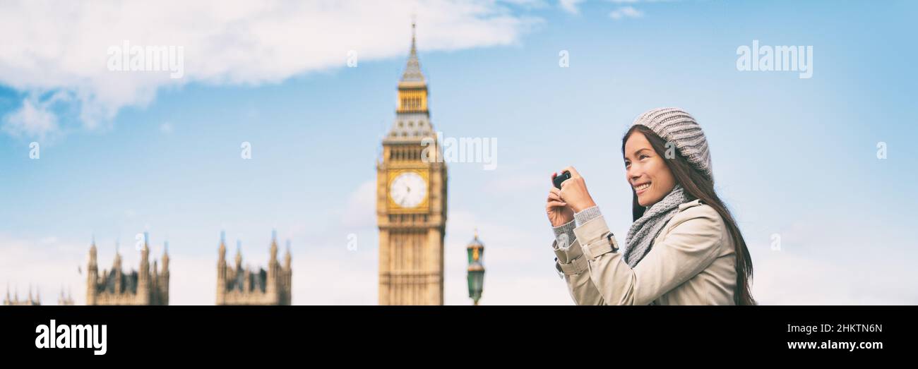 London europe travel woman taking pictures with phone panorama banner. Tourist holding smartphone camera taking photos at Big Ben, Westminster Bridge Stock Photo
