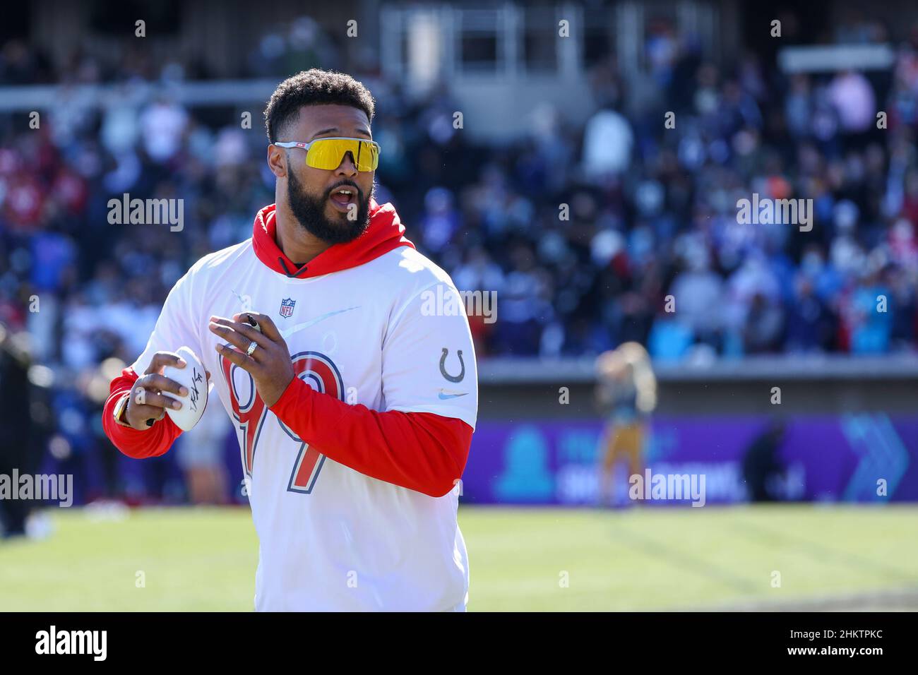Las Vegas, Nevada, USA. 5th Feb, 2022. Indianapolis Colts defensive line DeForest Buckner (99) signed a souvenir football and is throwing it into the crowd during the AFC Pro Bowl Practice at Las Vegas Ballpark in Las Vegas, Nevada. Darren Lee/CSM/Alamy Live News Stock Photo