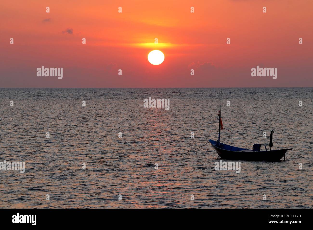 fishing boat in the sea with beautiful sunset background Stock Photo ...