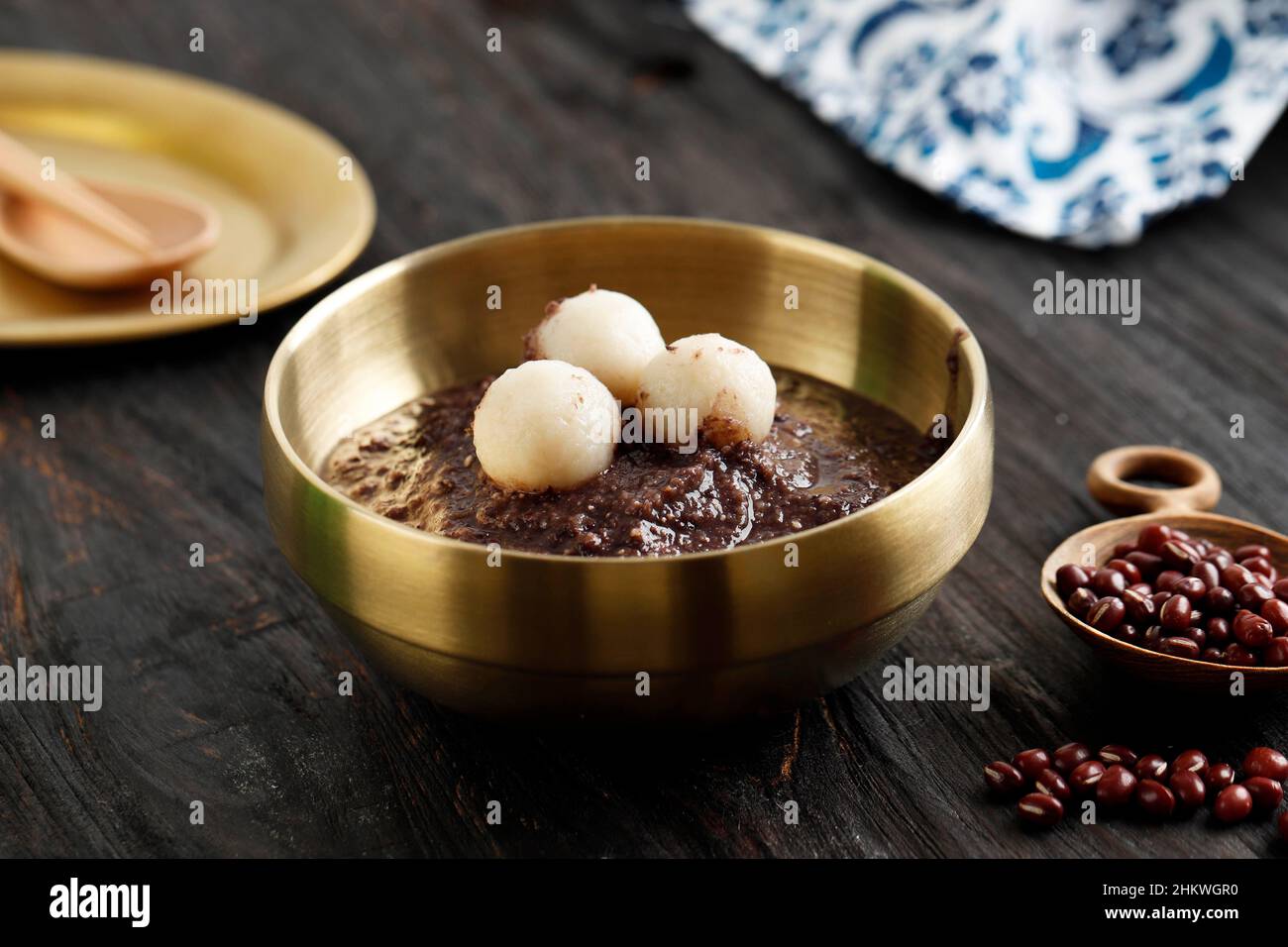 Korean Food: Dongji Patjuk Red Bean Porridge, Served on Golden Bowl Stock Photo
