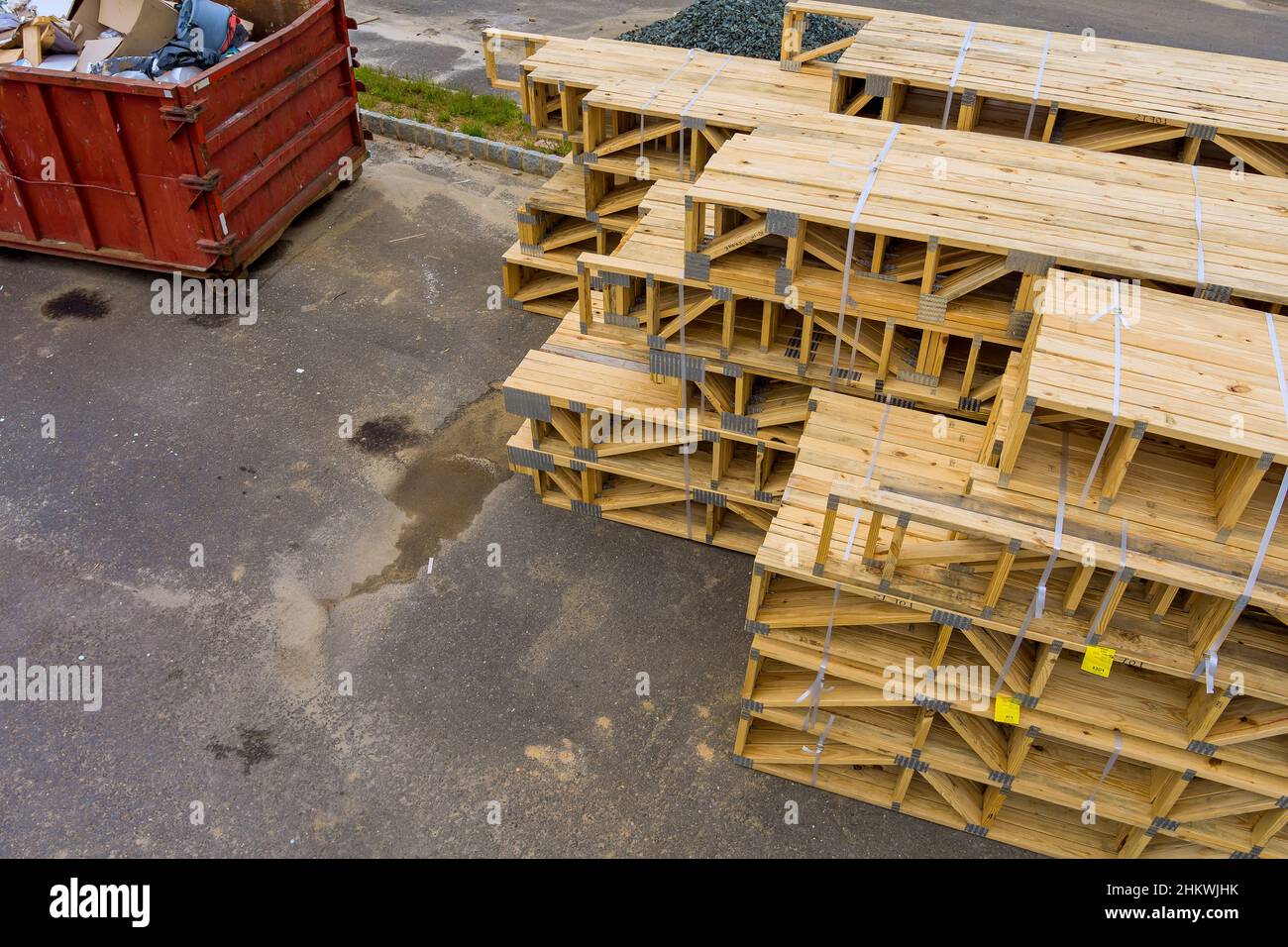 Wooden boards,timber building materials for garbage construction near container Stock Photo