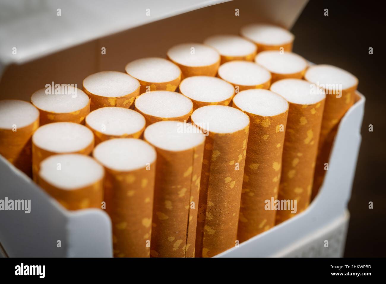 A macro photograph of the filter ends of an open pack of cigarettes. Stock Photo