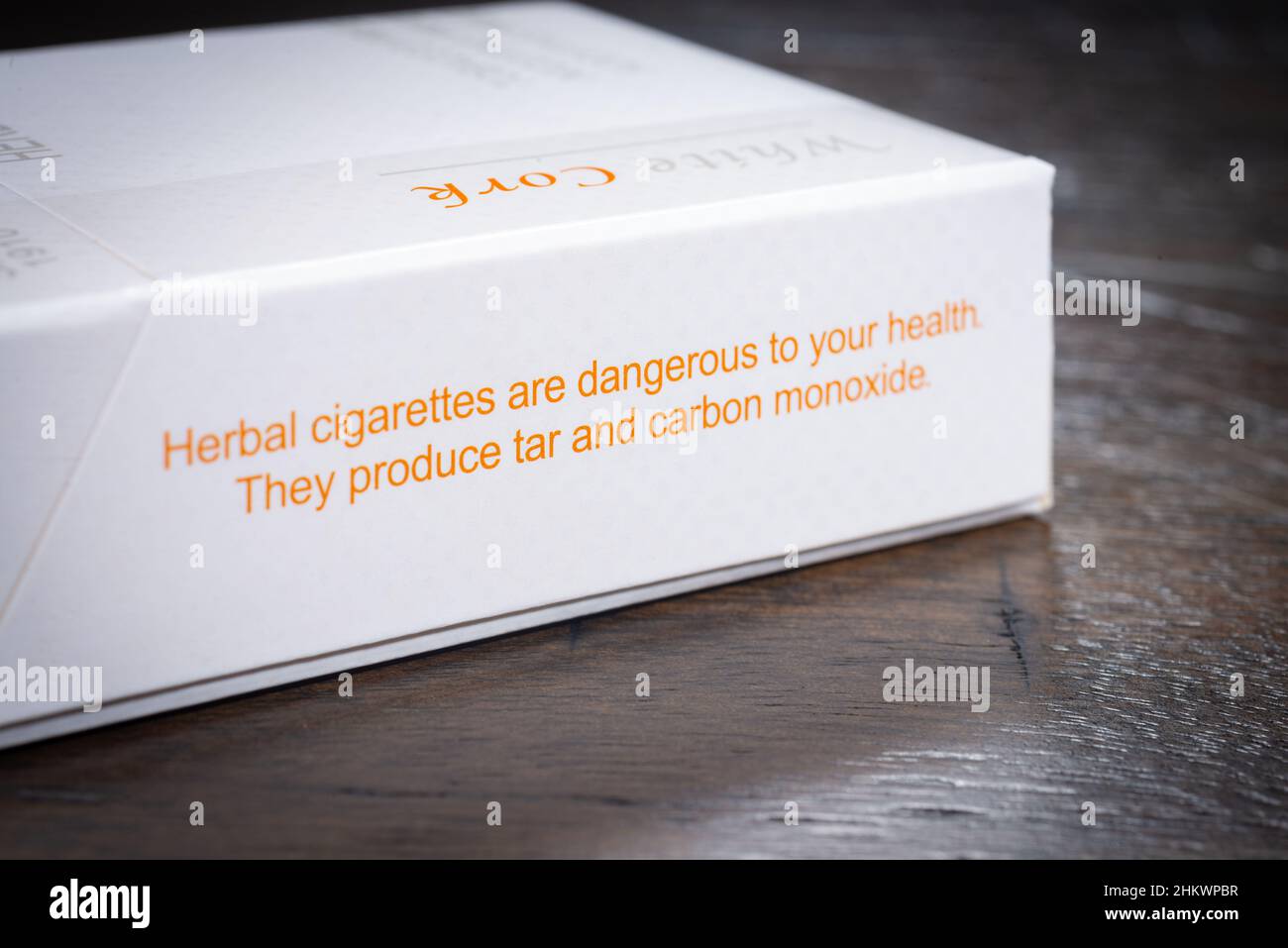 SAINT CLOUD, MINNESOTA - 5 FEBRUARY, 2022: A pack of Honeyrose Brand herbal cigarettes sits on a wooden table. Stock Photo