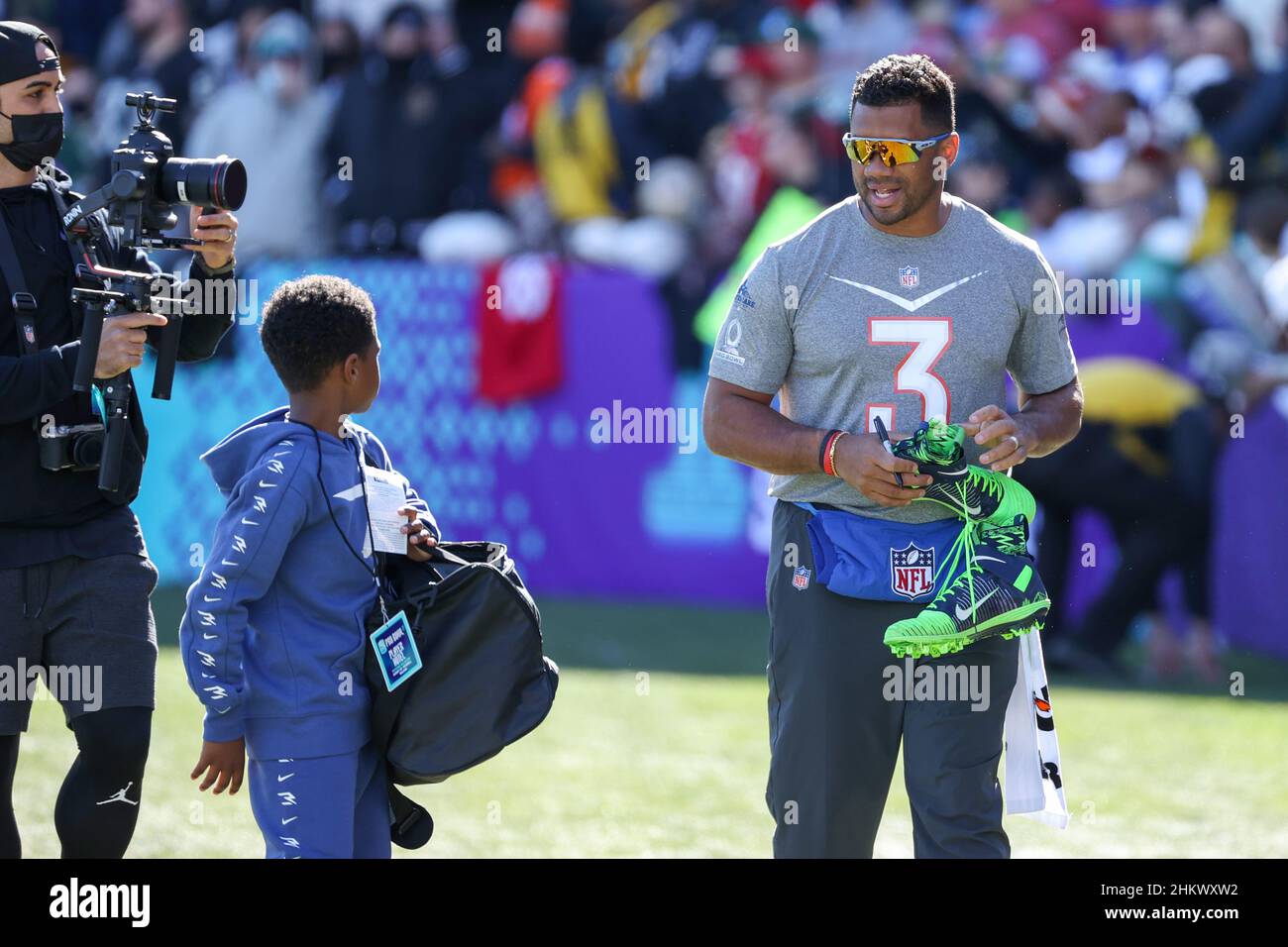 Las Vegas, Nevada, USA. 5th Feb, 2022. Seattle Seahawks quarterback Russell Wilson (3) autographing and giving away shoes during the NFC Pro Bowl Practice at Las Vegas Ballpark in Las Vegas, Nevada. Darren Lee/CSM/Alamy Live News Stock Photo