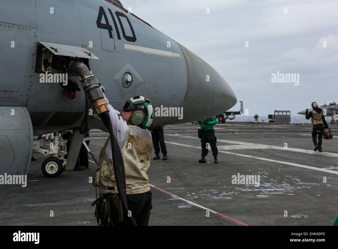 PHILIPPINE SEA (Feb. 5, 2022) Aviation Electronics Technician 2nd Class Alycia  Starr, from Greensboro, N.C., assigned to the “Vigilantes” of Strike  Fighter Squadron (VFA) 151, swaps out a control converter for an