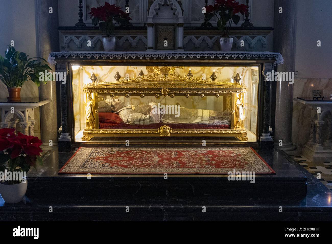 Corpse in a coffin with transparent walls in the church of Bobbio, Piacenza Stock Photo