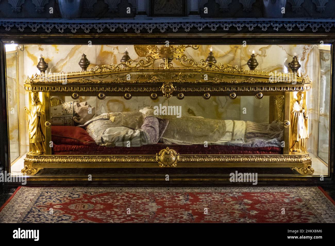 Corpse in a coffin with transparent walls in the church of Bobbio, Piacenza Stock Photo