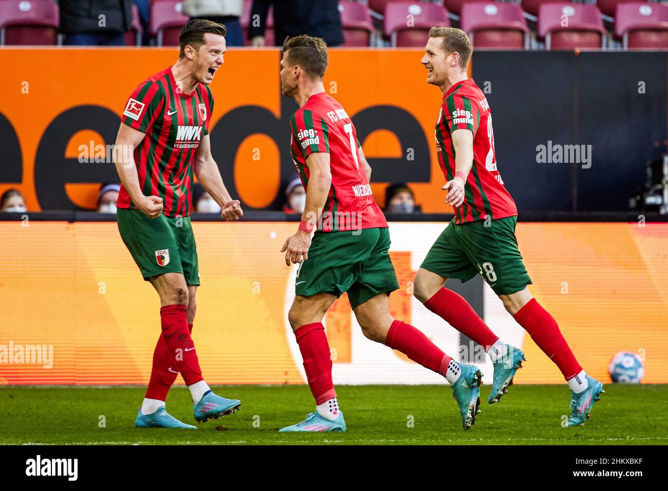 Augsburg, Germany. 5th Feb, 2022. Michael Gregoritsch (L) of Augsburg celebrates his scoring with teammates during a German Bundesliga match between FC Augsburg and 1. FC Union Berlin in Augsburg, Germany, Feb. 5, 2022. Credit: Peter Fastl/Xinhua/Alamy Live News Stock Photo