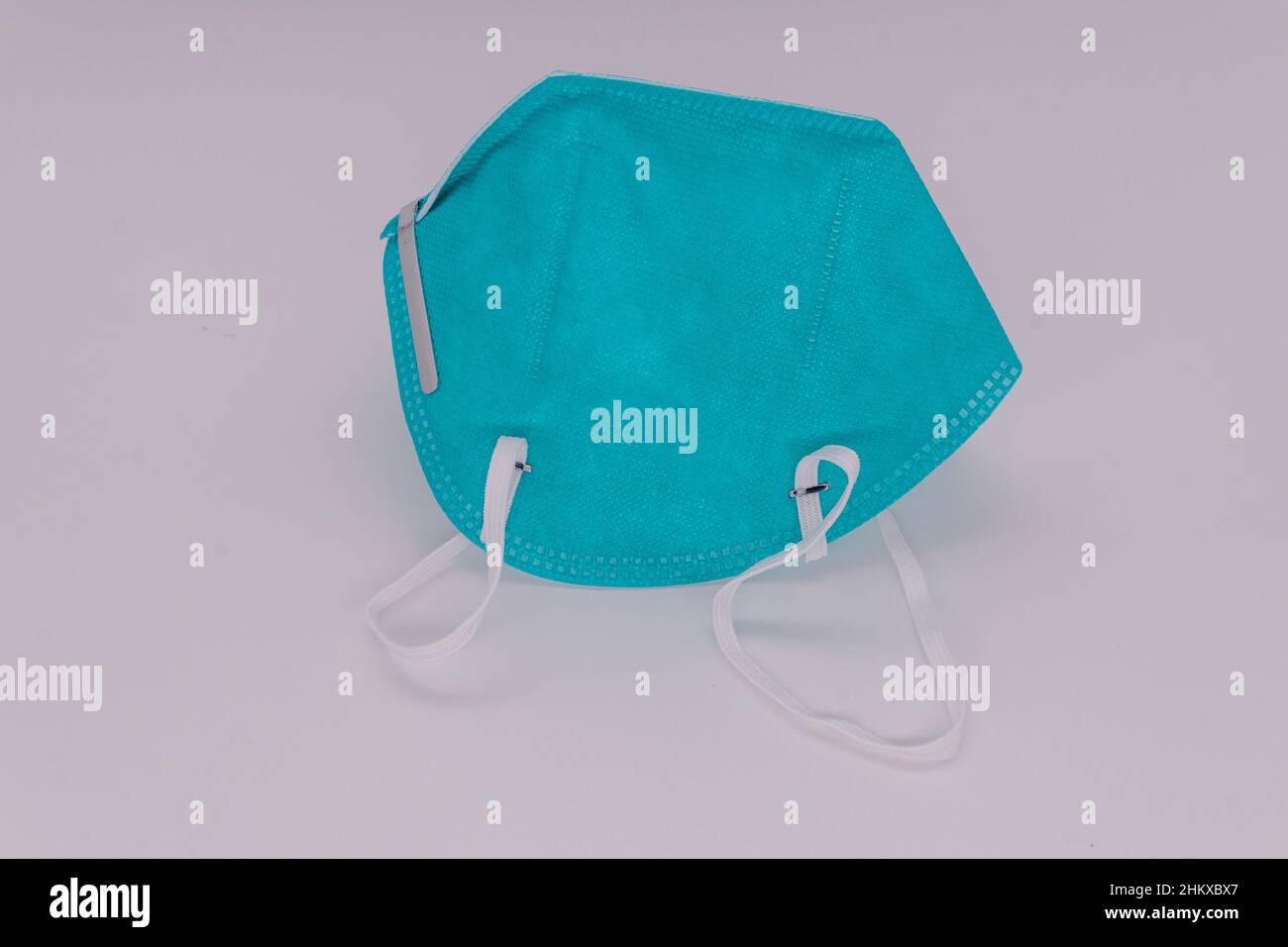 N95 respirator safety mask with head strap for tight fit. Isolated on