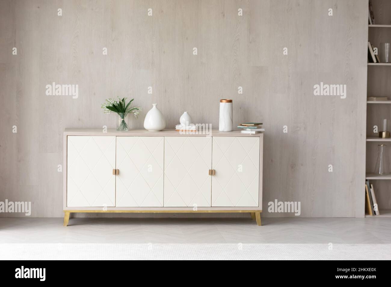 White modern dresser minimalistic furniture in empty room Stock Photo