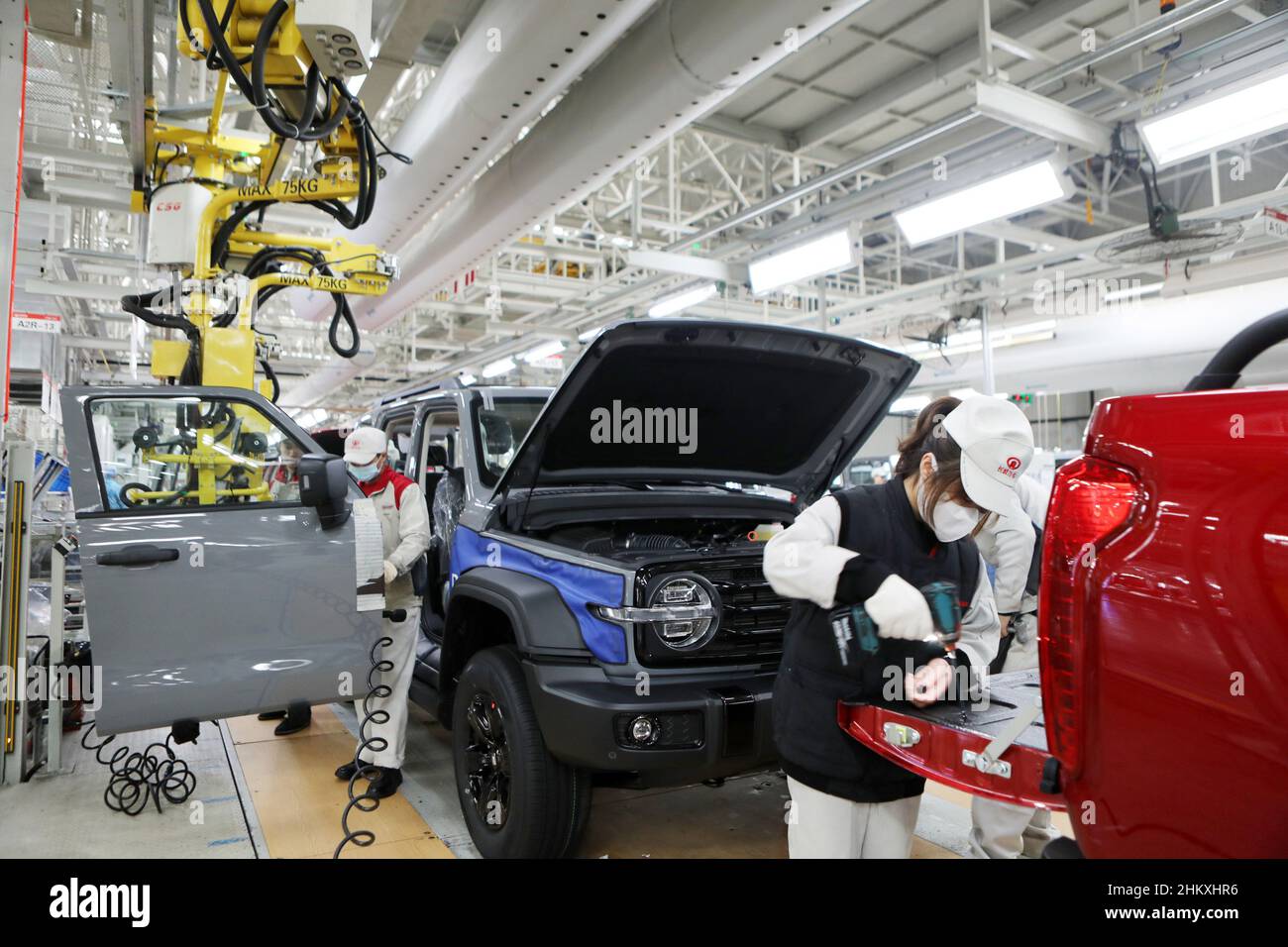 CHONGQING, CHINA FEBRUARY 6, 2022 Technicians install the body of a