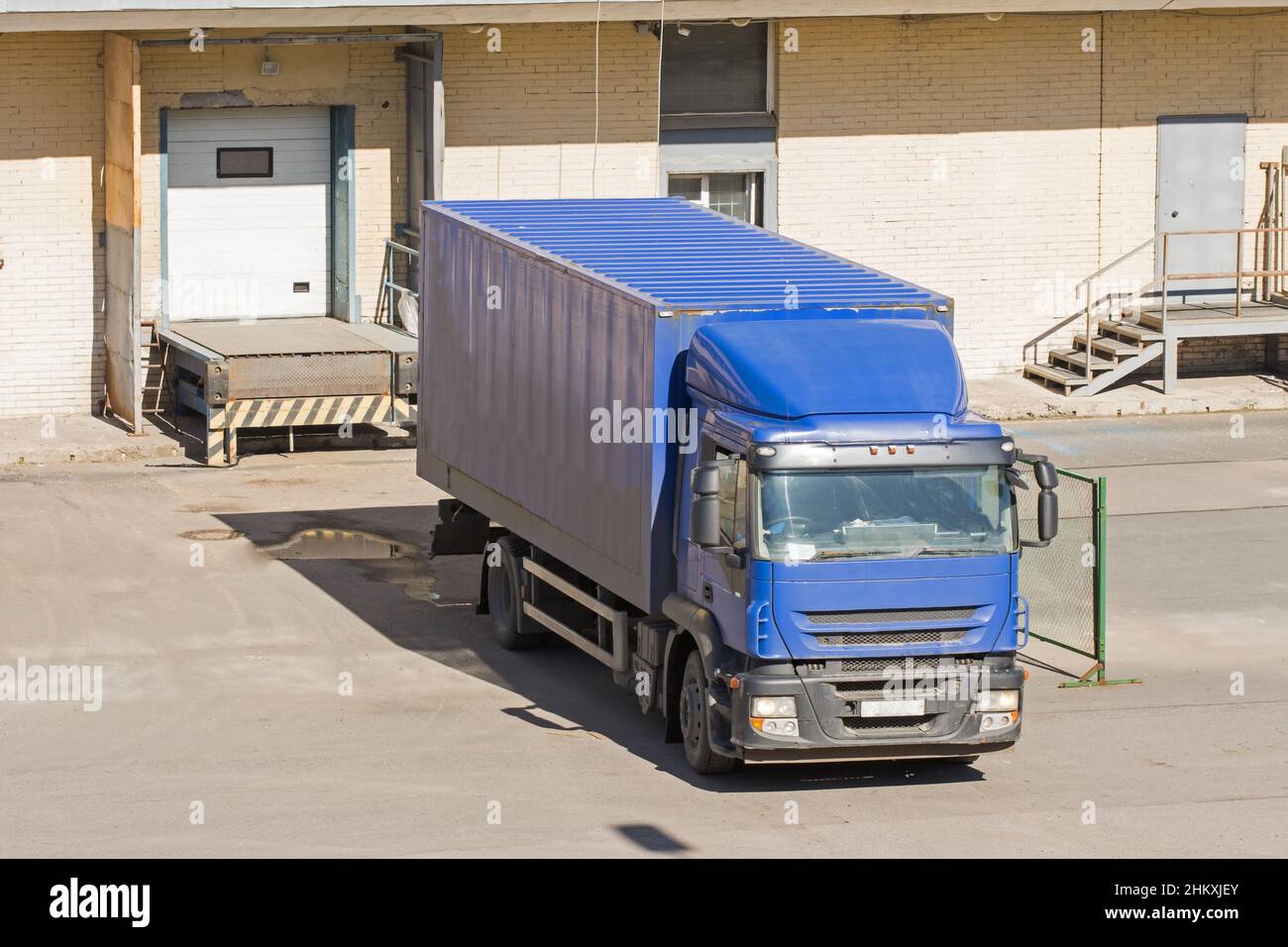 Truck loading goods, cargo, warehouse with doors Stock Photo