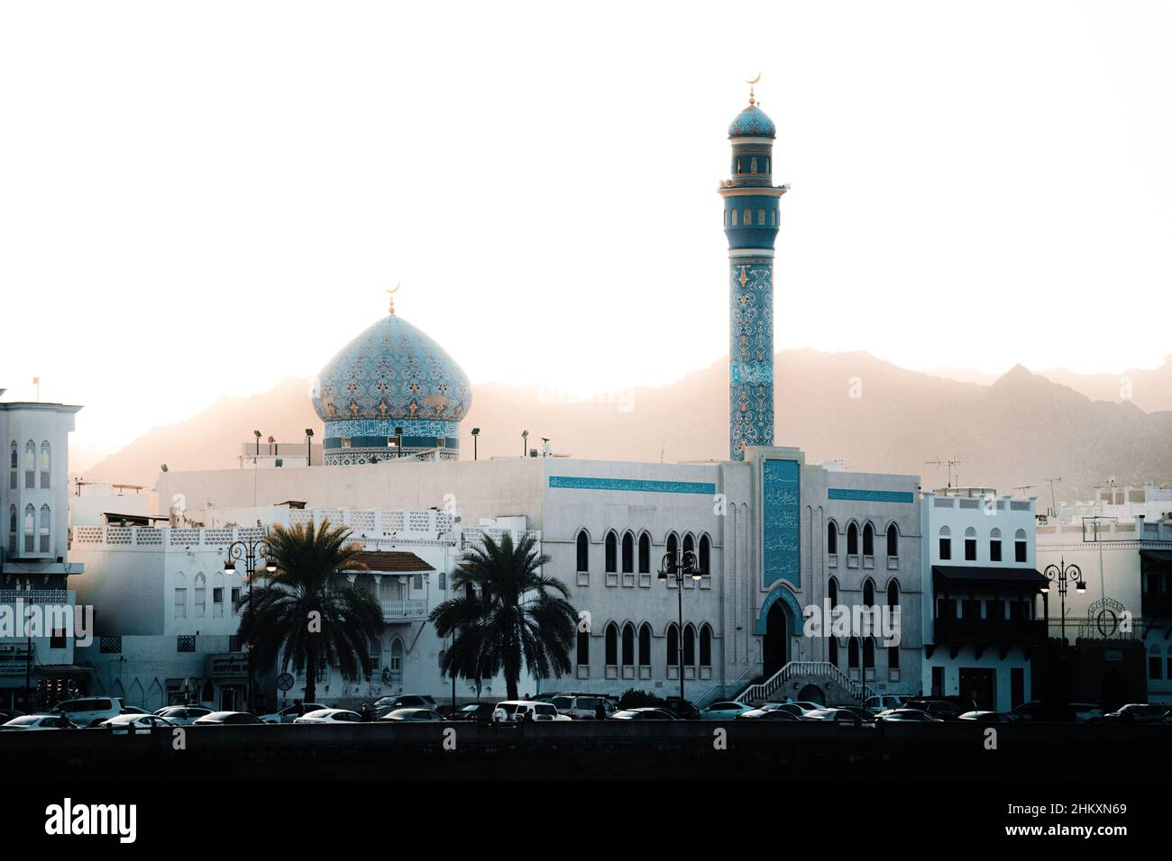 A mosque in Oman Muscat surrounded by mountains Stock Photo