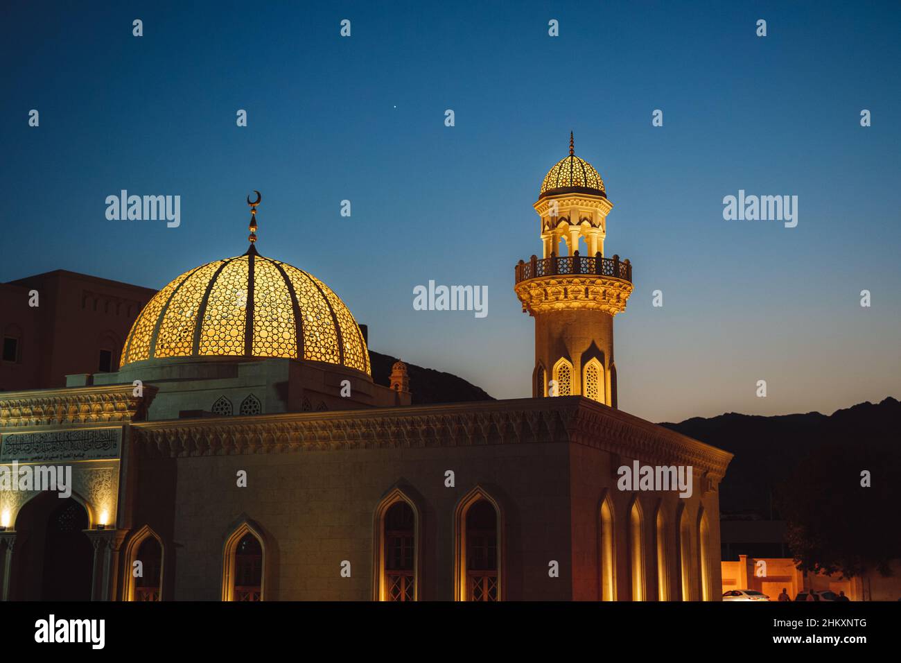 A mosque in Oman Muscat surrounded by mountains Stock Photo