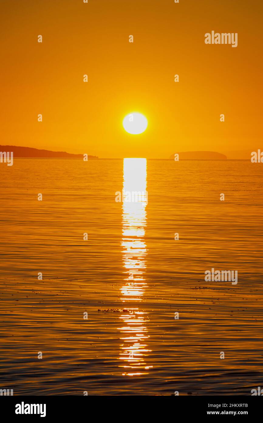 Bright sunshine with a streak of sunlight going across the channel