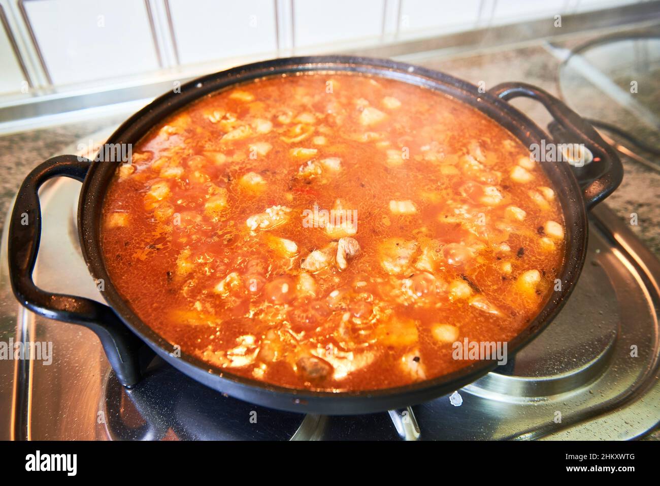 Preparation of a meat paella Stock Photo Alamy