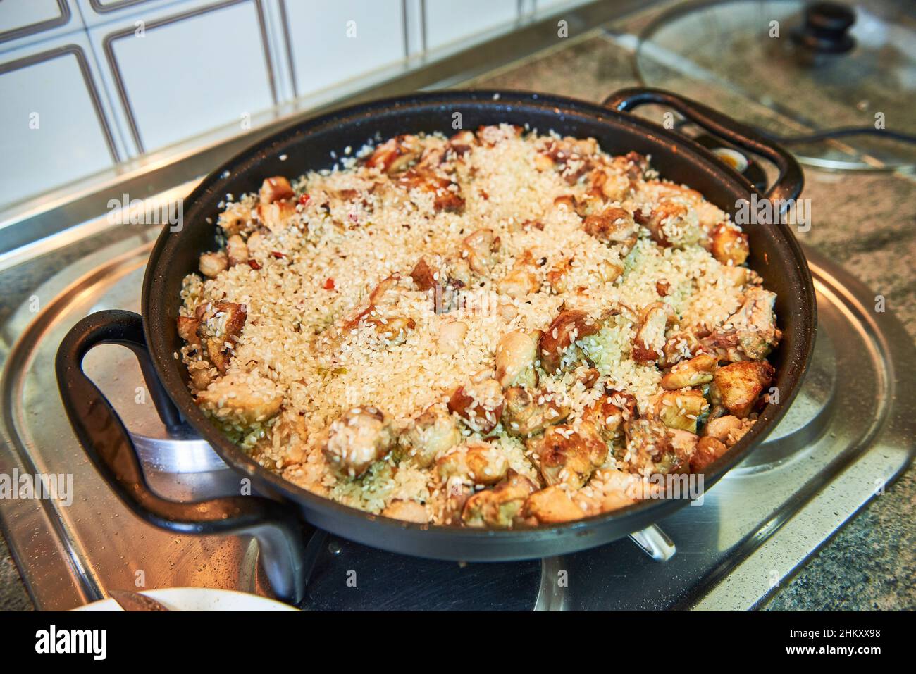 Preparation of a meat paella Stock Photo Alamy