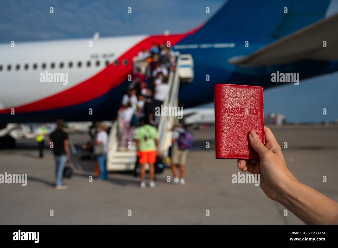 Hand holds passport plane hi-res stock photography and images - Alamy