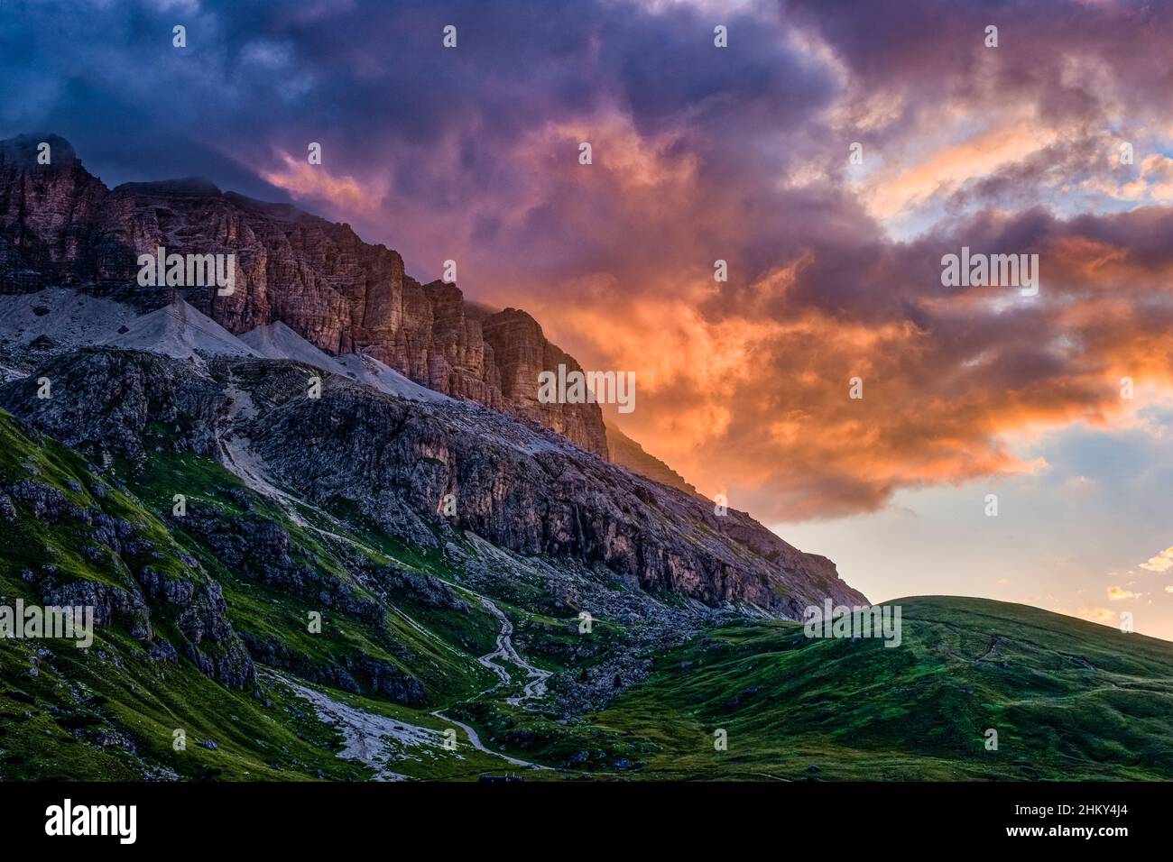 Rock faces of the Sella group, seen from Pordoi Pass at sunrise. Stock Photo