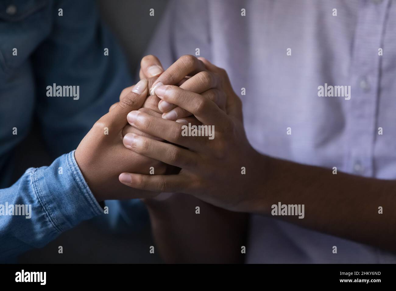 Young couple holding hands close hi-res stock photography and images ...