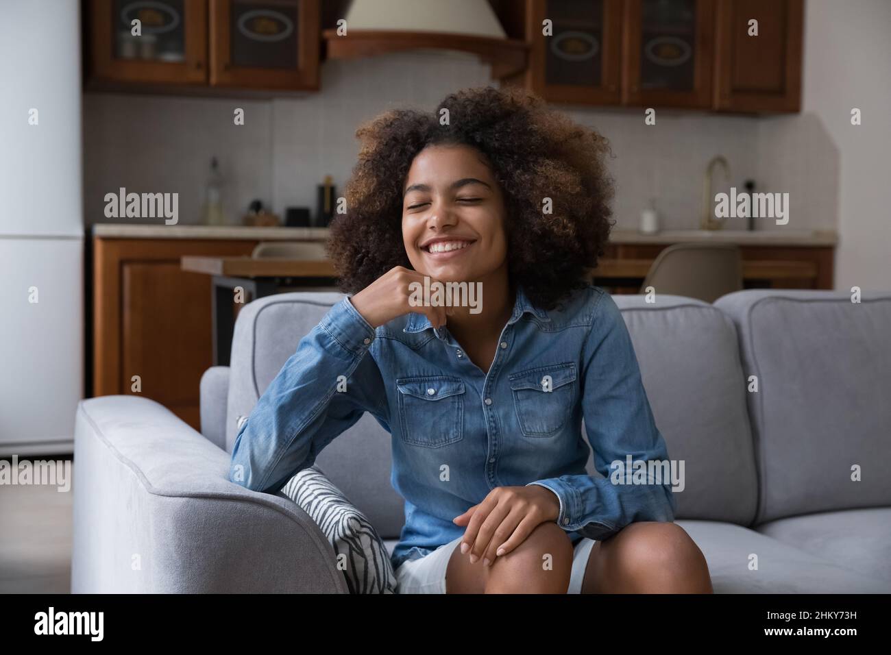 Happy carefree African American teen girl home head shot portrait Stock ...