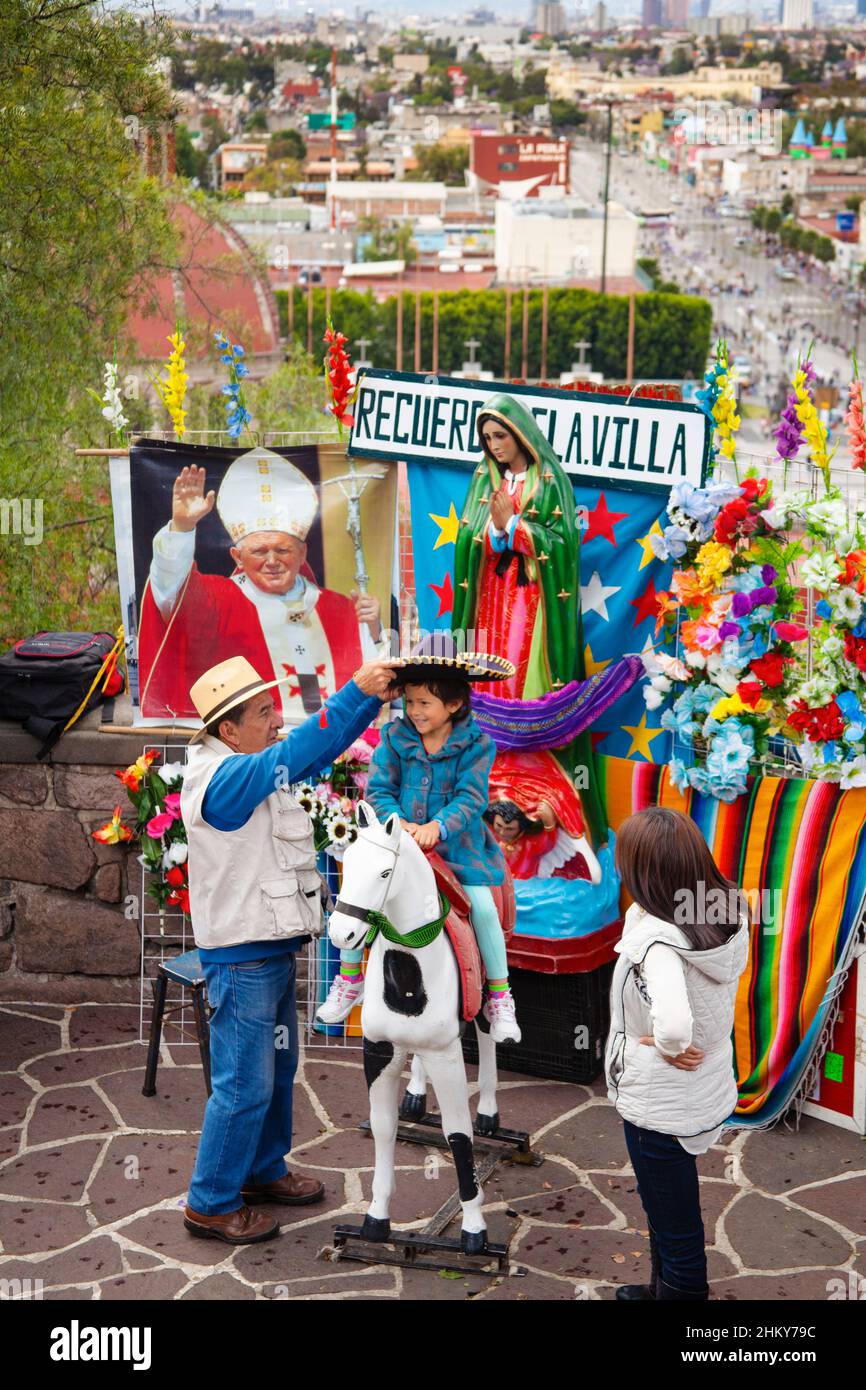 Family taking a photo at the Basilica of Our Lady of Guadalupe, Mexico City. North America Stock Photo