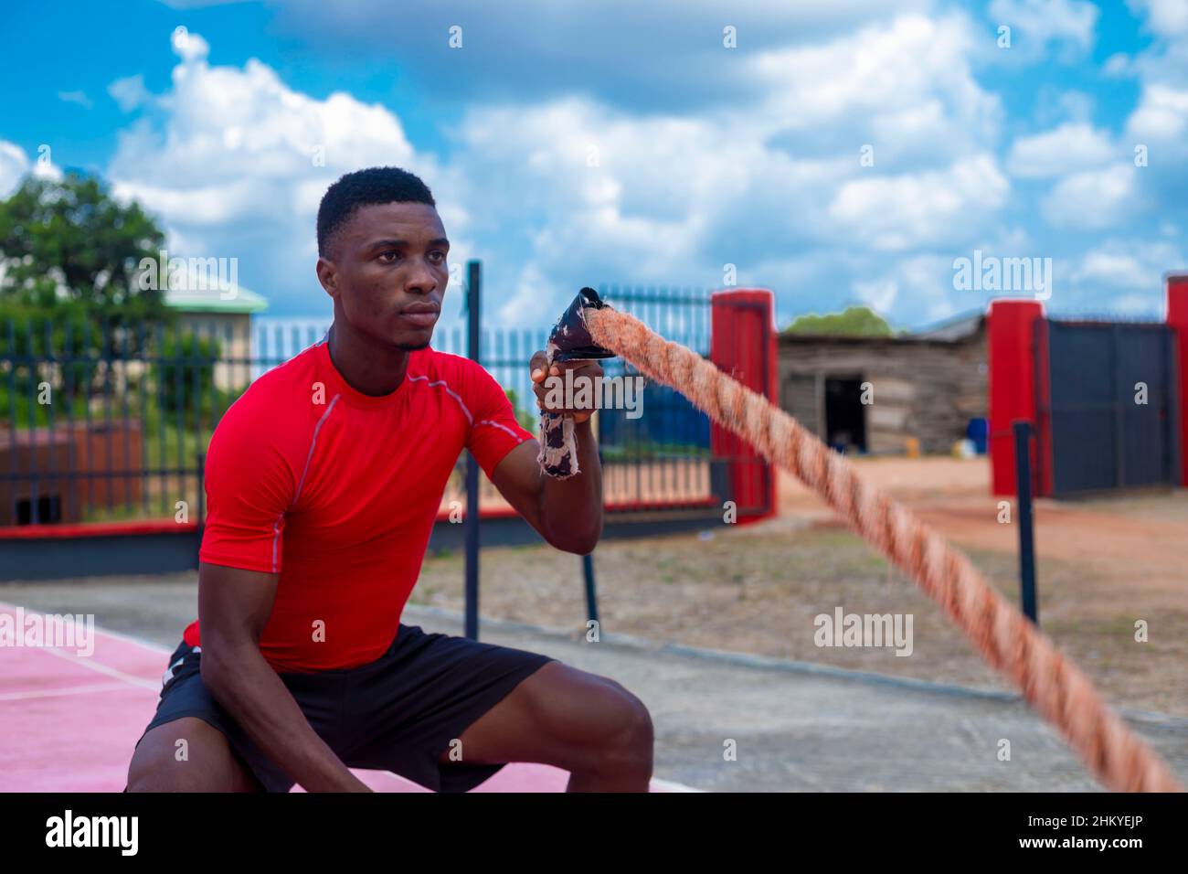 African Boxing Ropes african man Battle Rope strength training Stock Photo - Alamy