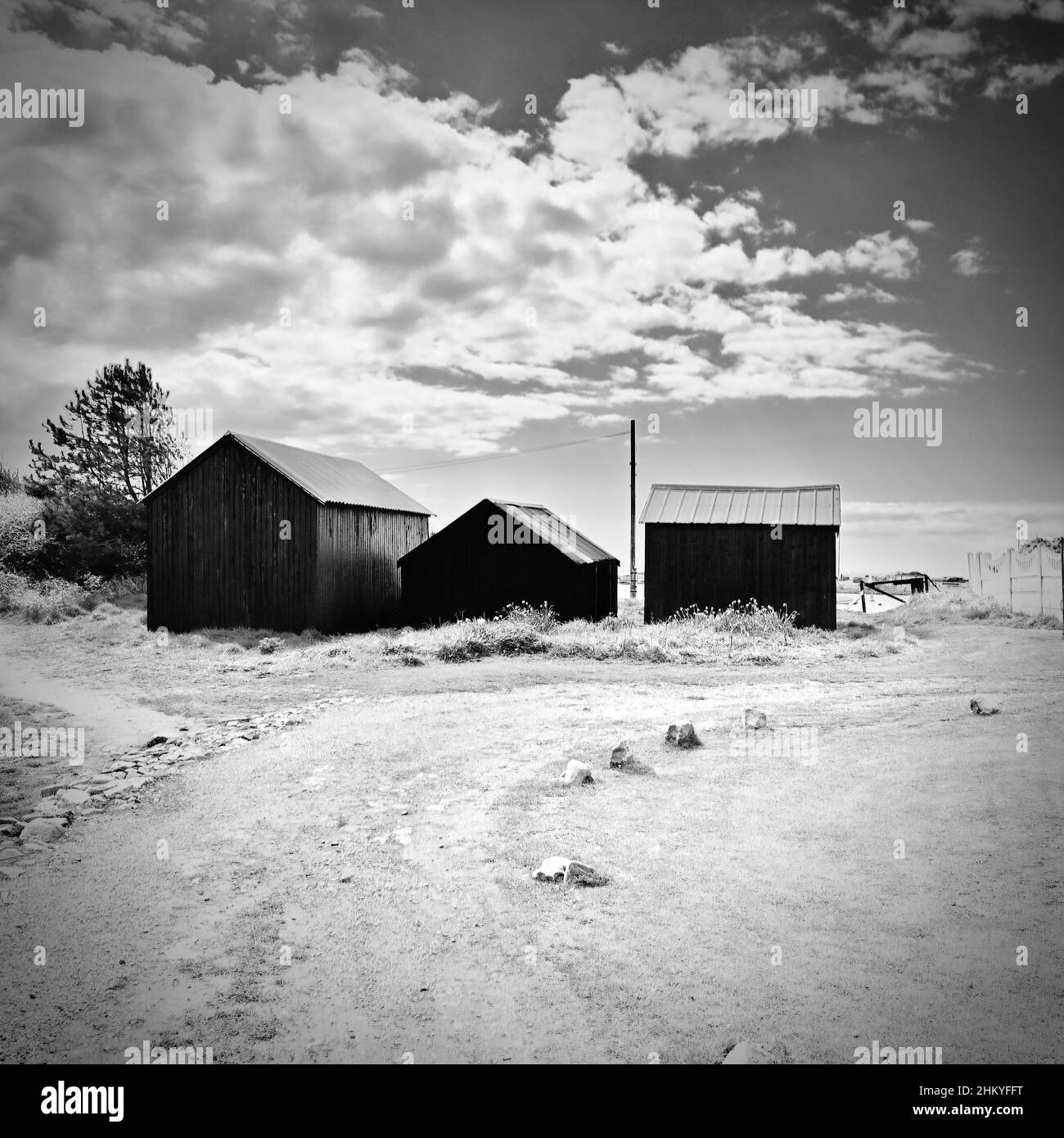 Three Sheds At End Of Dirt Track In Summer Stock Photo Alamy