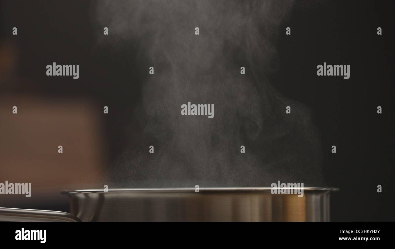 steam rising from saucepan closeup, wide photo Stock Photo - Alamy