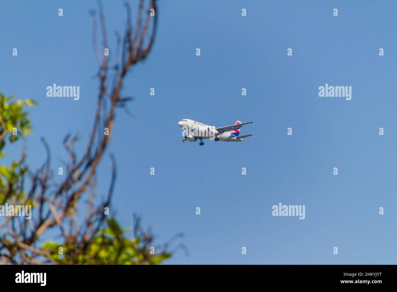 Airplane of LATAM Airlines company in Rio de Janeiro, Brazil - January 20, 2022: Airplane of Brazilian airline Latam, Flying with a beautiful blue sky Stock Photo