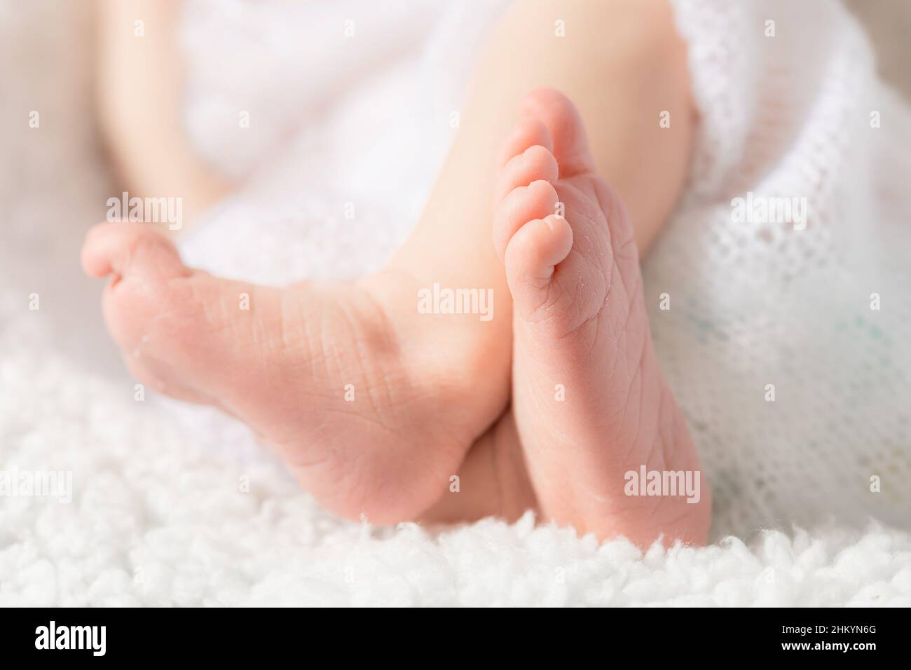 Baby legs close up on a light background Stock Photo