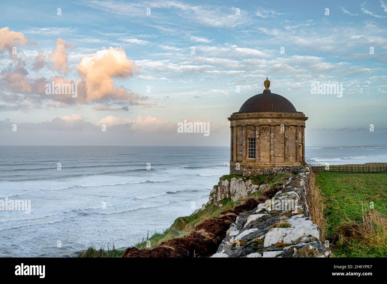 Downhill, Northern Ireland- Jan 9, 2022: the Mussenden Temple on the edge of an eroding clif on the north Coast of Ireland Stock Photo