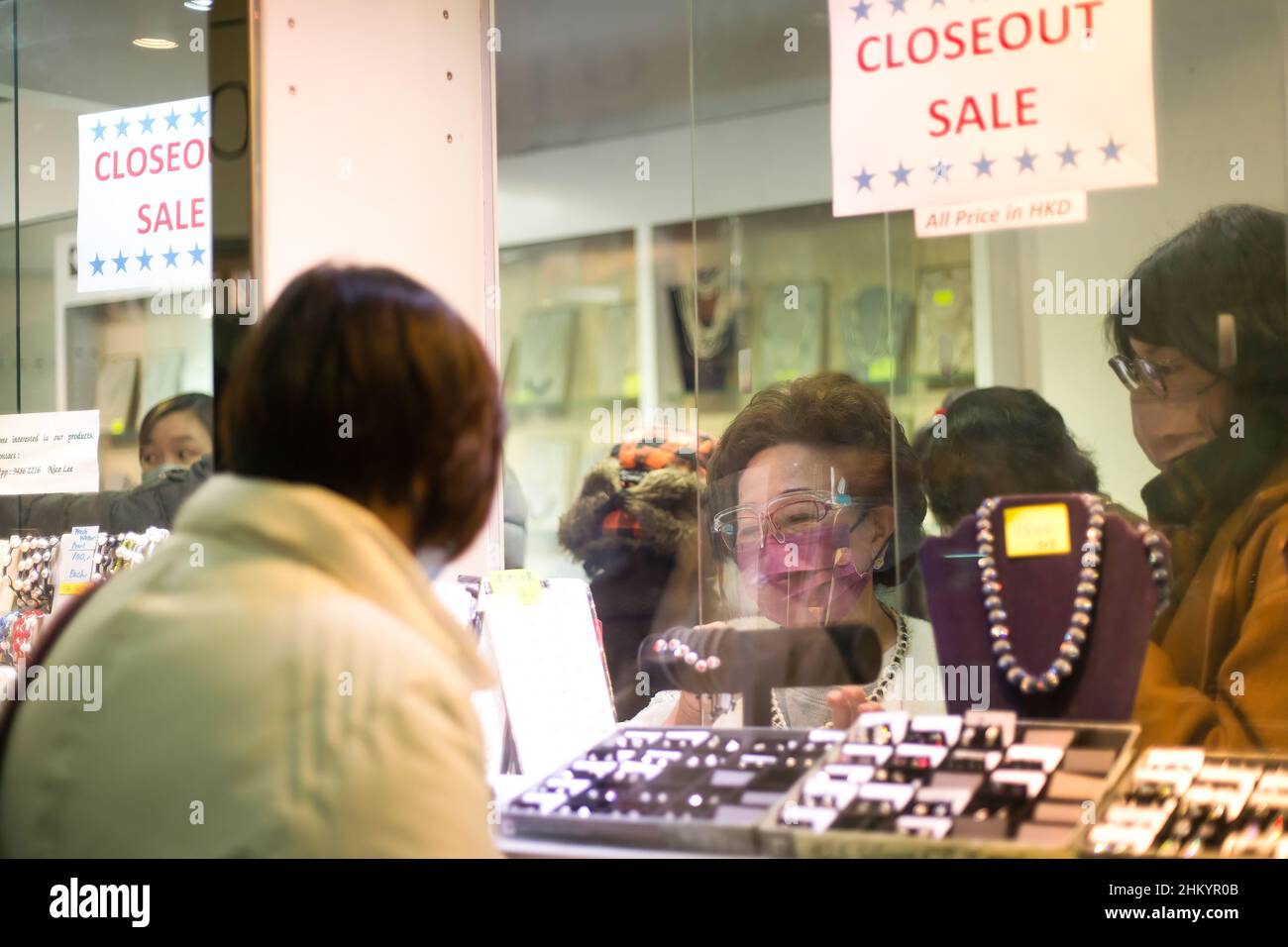 Hong Kong, China. 06th Feb, 2022. Customers are browsing products at a jewelry store in Fleet Arcade, Fenwick Pier. The Fenwick Pier, with a history of more than half a century, is about to be demolished. Citizens are grasping the last opportunity to visit this historic building. (Photo by Ben Lau/SOPA Images/Sipa USA) Credit: Sipa USA/Alamy Live News Stock Photo