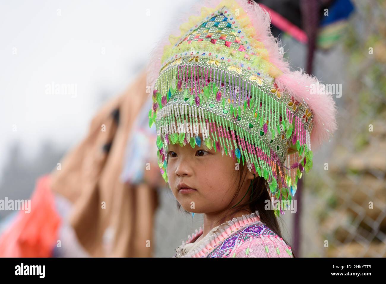 Young girl wearing a traditional Hmong tribe headress in Cat Cat village, Sapa (Sa Pa), Lao Cai Province, Vietnam, Southeast Asia Stock Photo