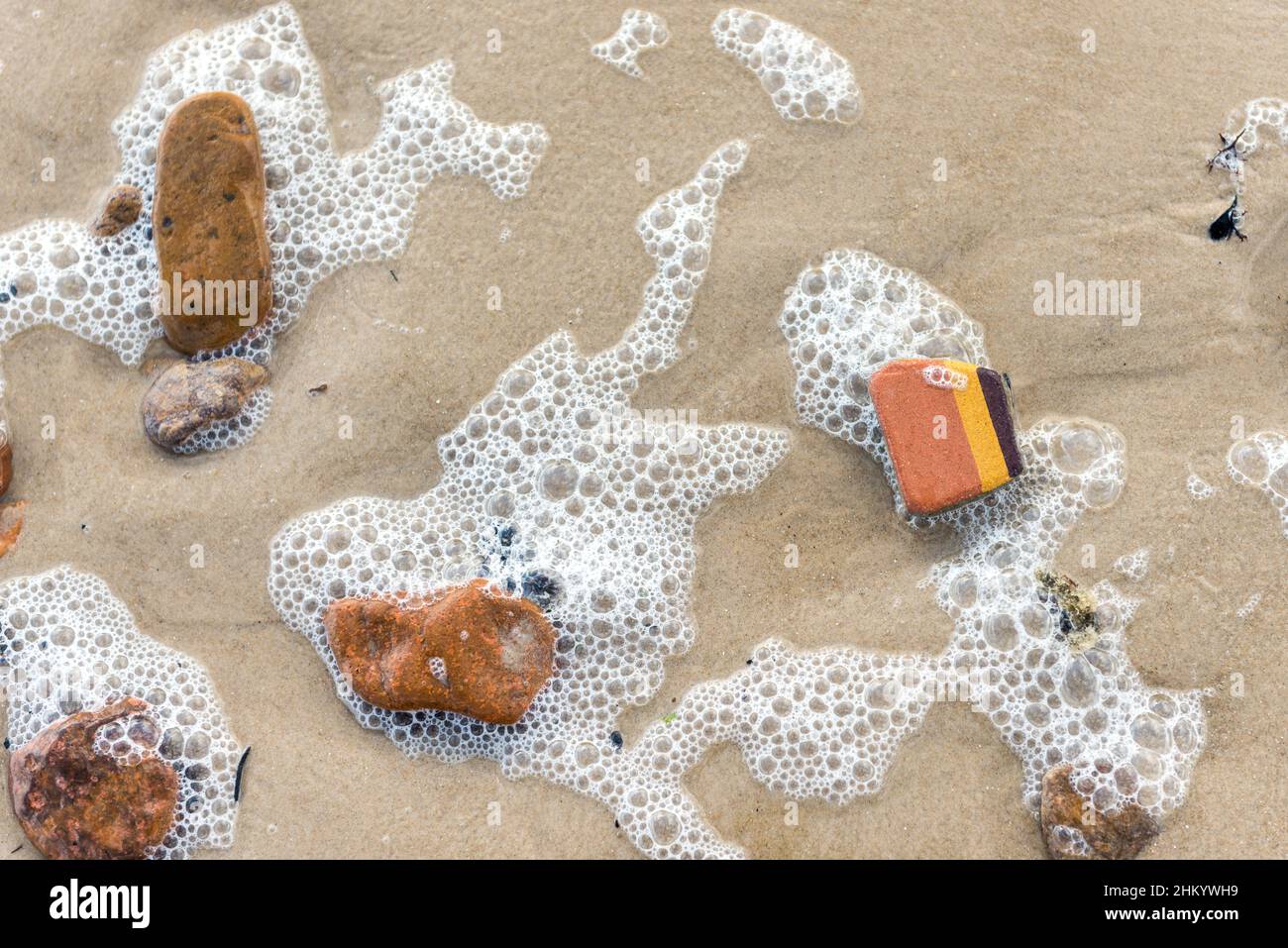 Pieces of old bricks eroded by the sea at the beach of Bella Vista, Maldonado, Uruguay. Stock Photo