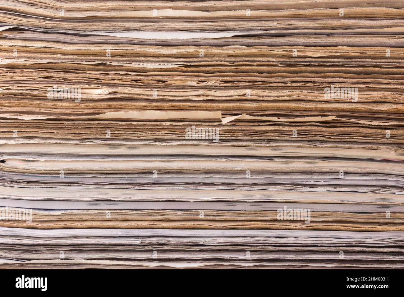 abstract of bundle of papers, stacked newspaper background texture, closeup view, waste paper recycling concept Stock Photo