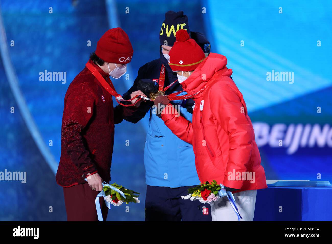 (L-R) Mikael Kingsbury (CAN), Walter Wallberg (SWE), Ikuma Horishima ...