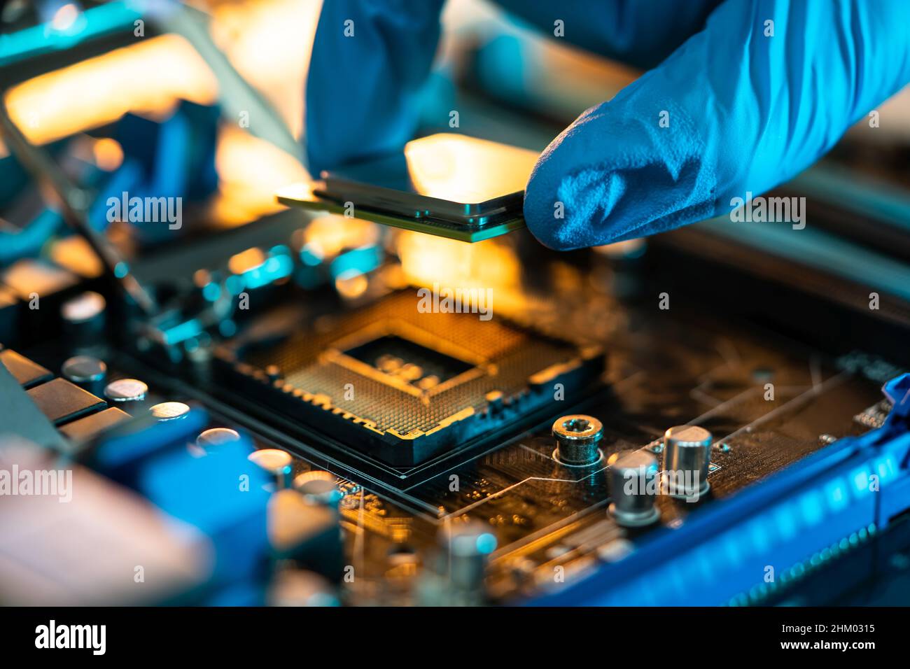 Motherboard Microchip In Hand. Computer Testing And Repair Stock Photo