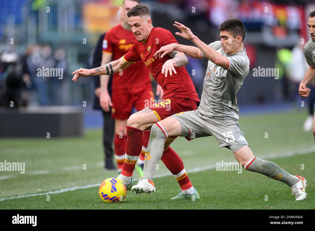 Johan Vasquez of Genoa CFC and Nicolò Zaniolo of AS Roma during football  Serie A Match at Stadio Olimpico, As Roma v Genoa on February 5, 2022 in  Rome, Italy. (Photo by