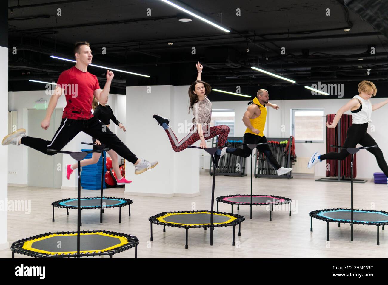 Endeløs Mordrin patron Women's and men's group on a sports trampoline, fitness training, healthy  life - a concept trampoline group batut instructor men, for female team for  Stock Photo - Alamy
