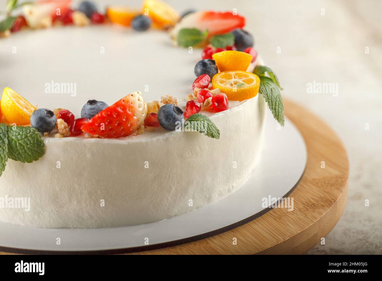 Carrotorange cake for diabetics decorated with fresh fruit and mint
