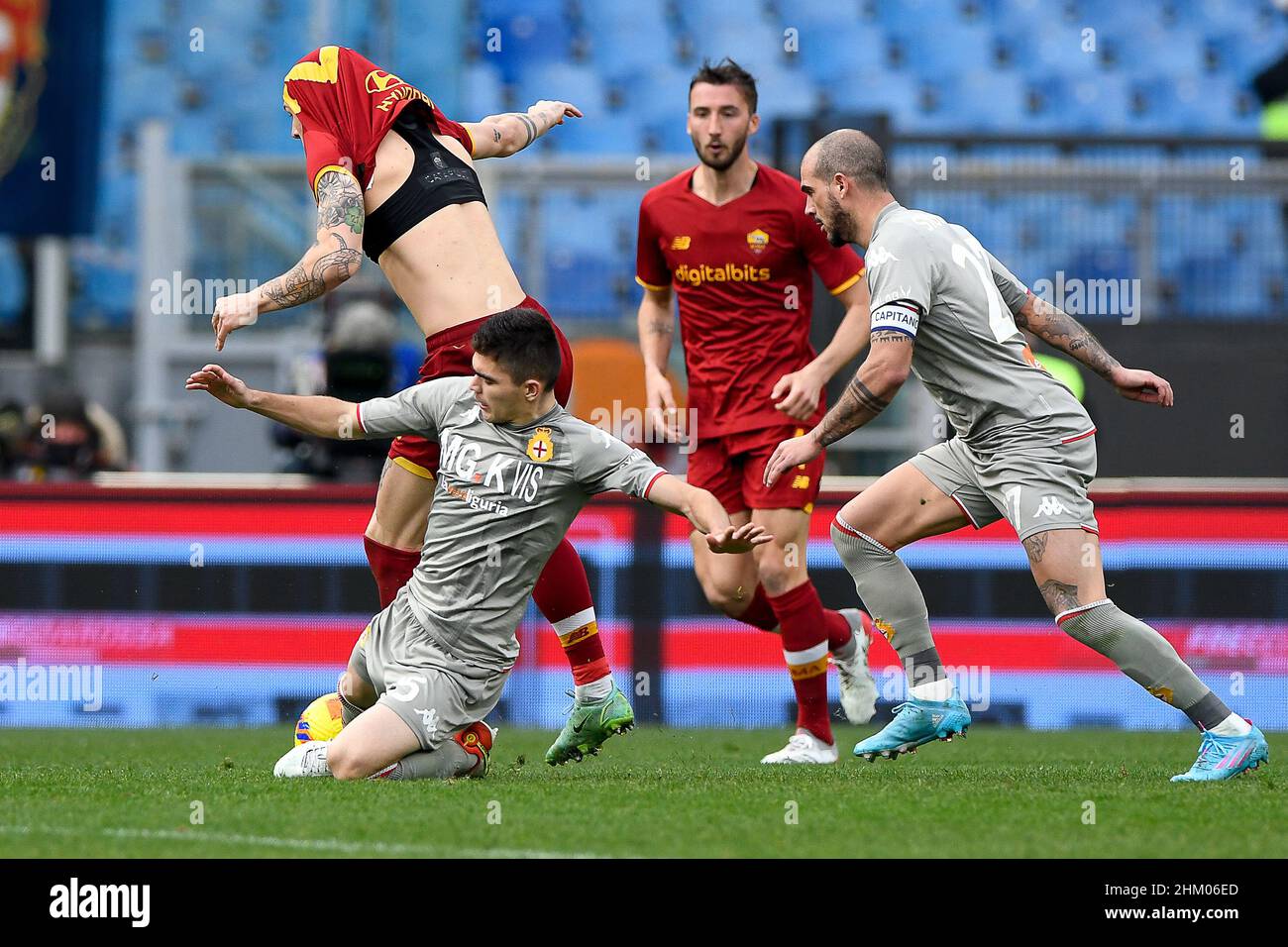 Johan Vasquez of Genoa CFC and Nicolò Zaniolo of AS Roma during football  Serie A Match at Stadio Olimpico, As Roma v Genoa on February 5, 2022 in  Rome, Italy. (Photo by